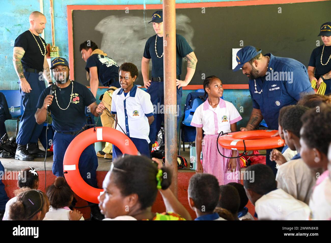 U.S. Coast Guard Cutter Harriet Lane (WMEC 903) crew members show ...