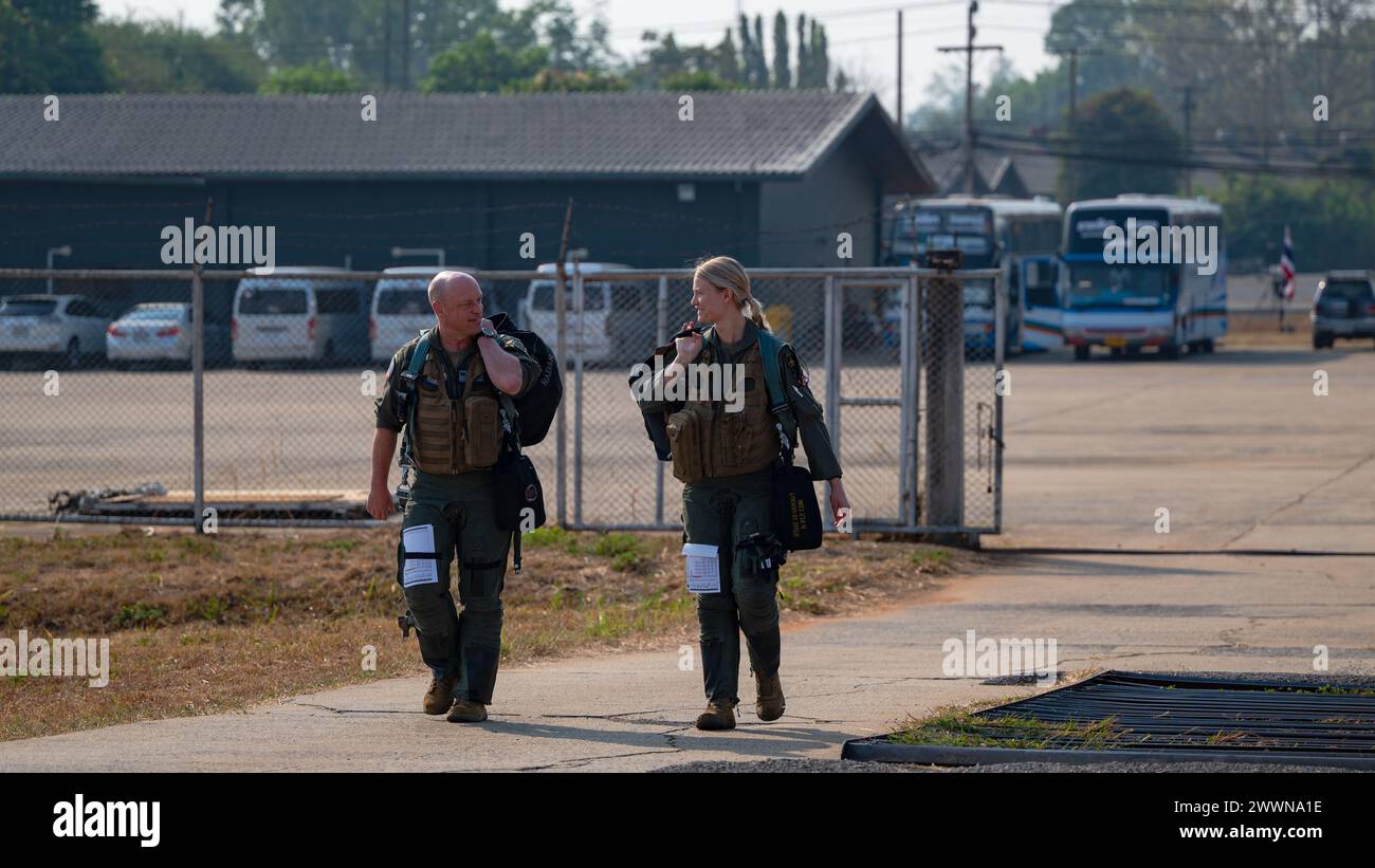 Col. Matthew C. Gaetke, left, 8th Fighter Wing commander, and 2nd Lt. Brynn Lunaas, 80th Fighter Squadron F-16 Fighting Falcon pilot, walk to the flightline to board F-16s during Joint Exercise Cobra Gold 24 at Korat Royal Thai Air Force Base, Thailand, 29 Feb. 2024. Cobra Gold is the largest joint exercise in mainland Asia and a concrete example of the strong alliance and strategic relationship between Thailand and the United States. The 8th FW has maintained participation in Cobra Gold throughout the exercises’ 43-year history, demonstrating the commitment to ensuring a free and open Indo-Pa Stock Photo