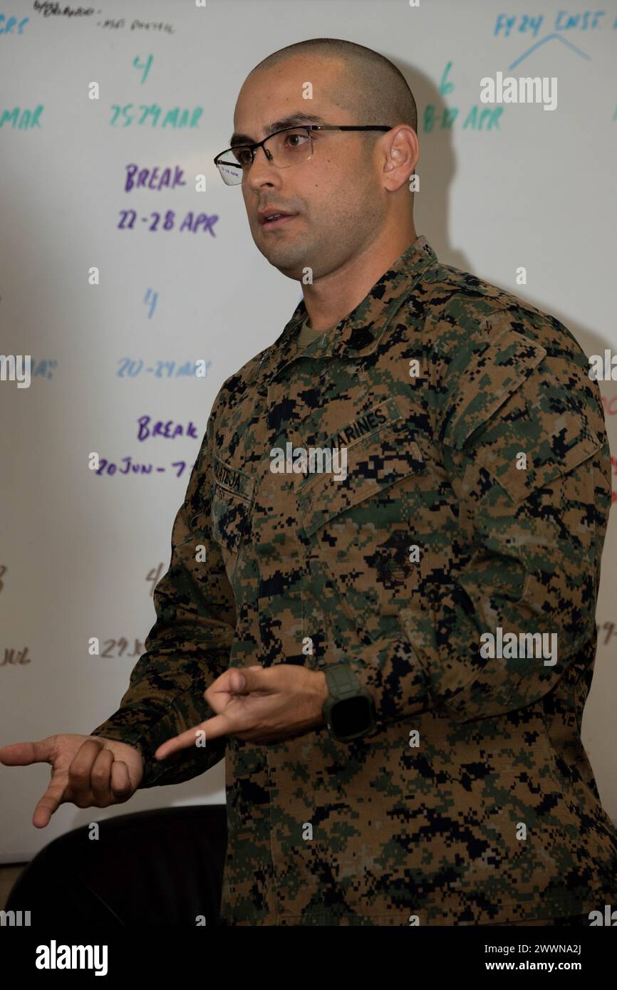 U.S. Marine Corps Gunnery Sgt. Gustavo Delateja, a native of Miami, Florida and a basic recruiter course chief with recruiting school, gives a brief on the benefits of Special Duty Assignments to the corporal’s course with Combat Logistic Battalion 5, 1st Marine Logistics Group, I Marine Expeditionary Force, at Marine Corps Recruit Depot San Diego, Feb. 5, 2024. Corporals course provides students with the basic knowledge and skills necessary to become successful small-unit leaders using realistic problem-based situations that a Marine corporal will encounter.  Marine Corps Stock Photo