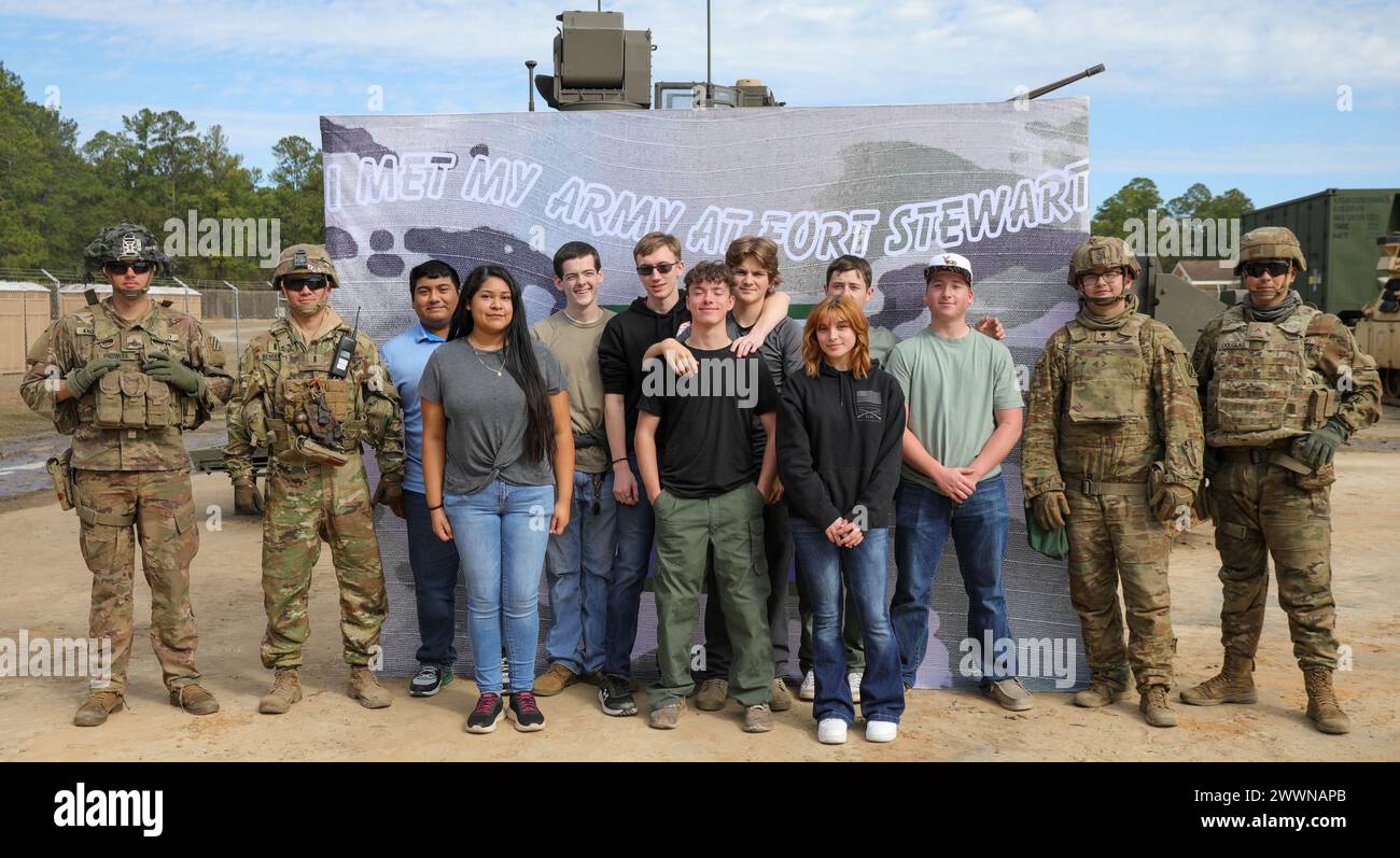 Soldiers assigned to 3rd Infantry Division, gather for a photo with ...