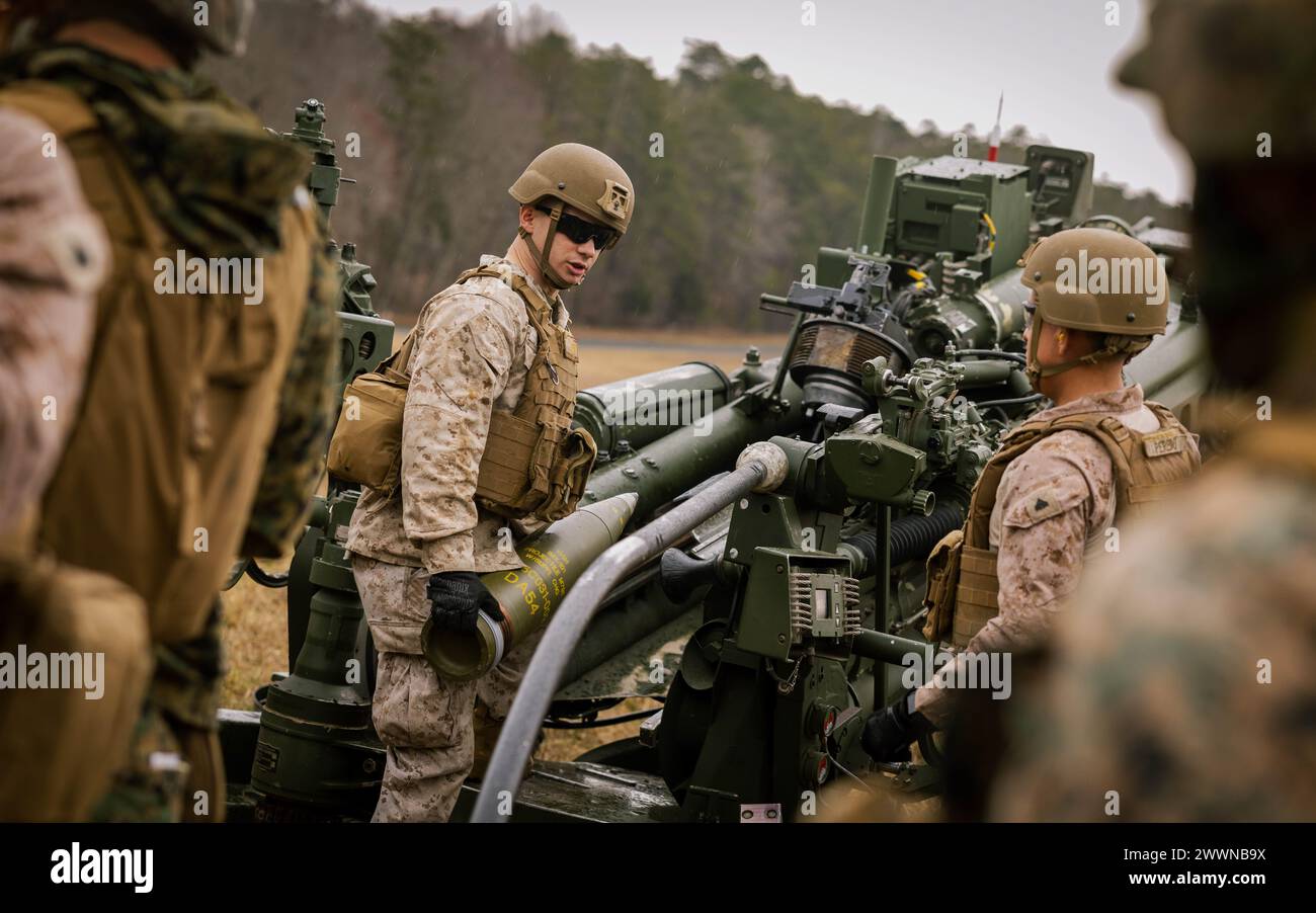 U.S. Marines with The Basic School demonstrate how to operate an M777 ...