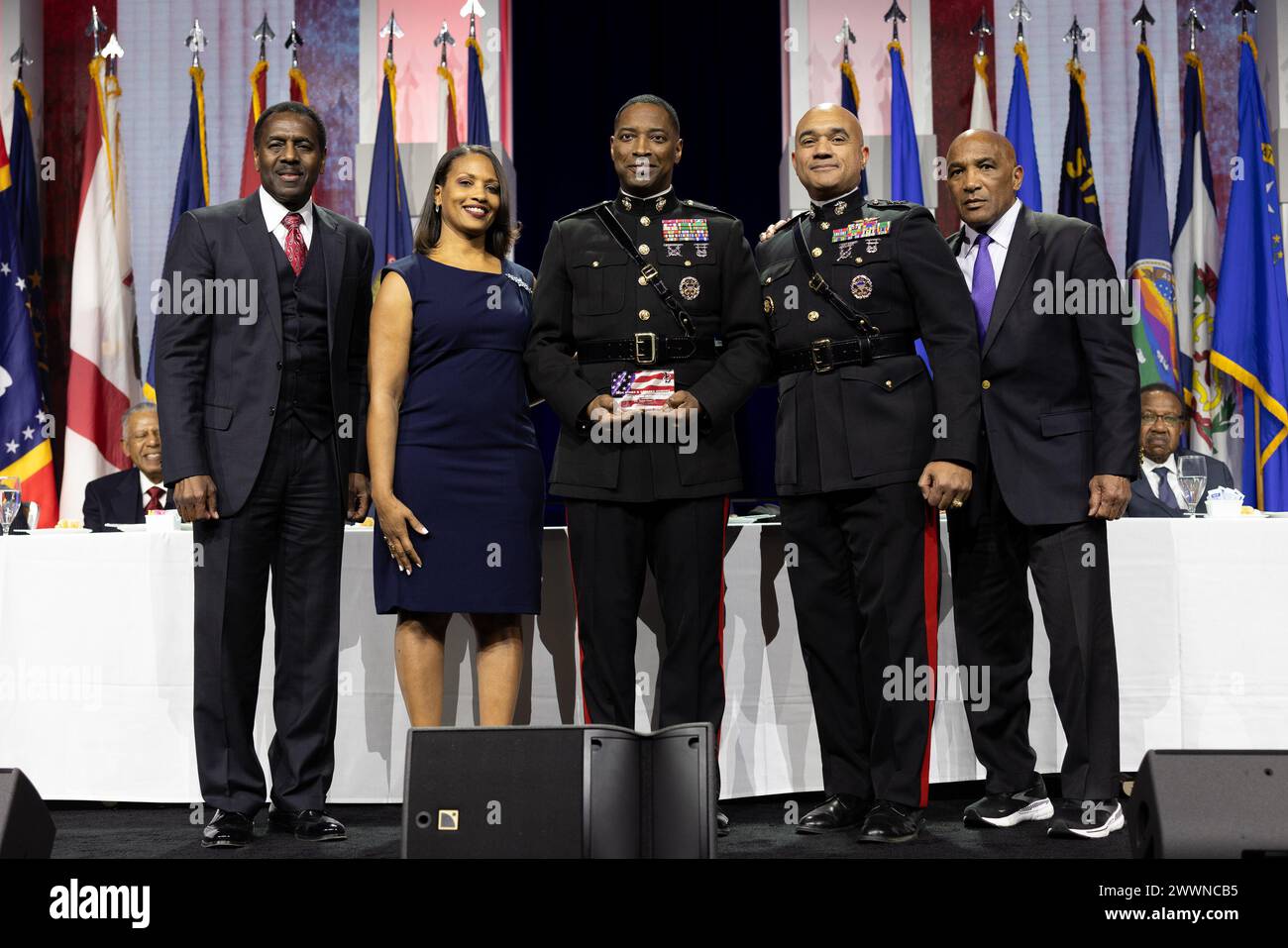 U.S. Marine Corps Lt. Gen. Brian W. Cavanaugh, Commander, Fleet Marine Force, Atlantic, Marine Forces Command, Commanding General, Marine Forces Northern Command, center right, stands with Brig. Gen. Ahmed Williamson, center, recipient of 2024 Stars and Stripes Honors award, at the 38th annual Becoming Everything You Are (BEYA) conference, Baltimore, Feb. 16, 2024. During the conference, Cavanaugh participated in mentoring sessions for STEM (science, technology, math, engineering) students and represented the Marine Corps to present the 2024 BEYA Stars and Stripes Honors award for outstanding Stock Photo