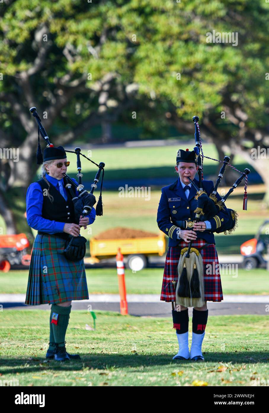 Members of the Celtic Kula Pipe Band of Hawaii play the bagpipes to honor the life of U.S. Army