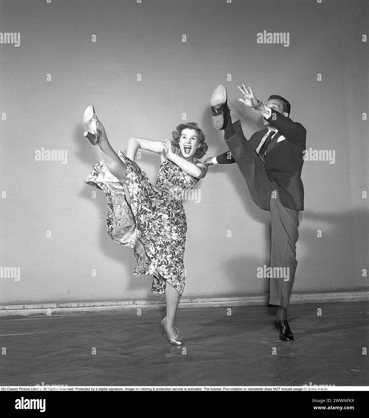Charleston dance. A Dance named for the harbor city of Charleston, South Carolina and was popularized in the United States by a 1923 tune called The Charleston. The peak for the Charleston as a dance by the public was mid 1926 to 1927. Pictured Sonja Stjernquist and John Ivar Deckner dancing the Charleston 1950.  Kristoffersson ref BA68-3 Stock Photo