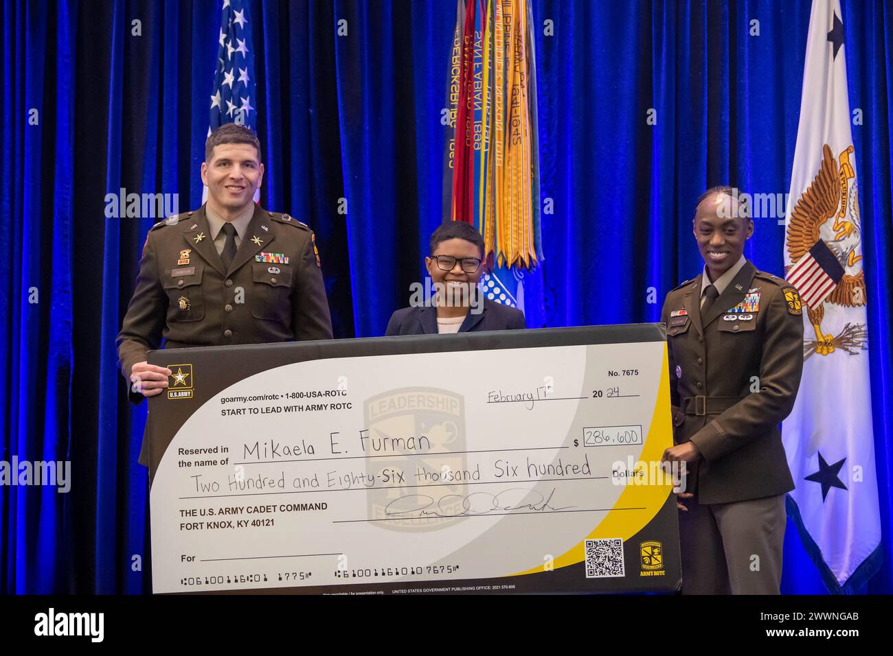 U.S. Army Brig. Gen. Amanda I. Azubuike, deputy commanding general of the U.S. Army Cadet Command, and Lt. Col. Brandon Thompson, professor of military science at Johns Hopkins University, present Johns Hopkins University’s Army ROTC Cadet Mikaela Furman, with a four-year National Army ROTC Scholarship at the Center of Influence event, hosted by the U.S. Army, during the 38th Annual Becoming Everything You Are, Science, Technology, Engineering and Mathematics (BEYA STEM) Conference, in Baltimore, Md., Feb. 17, 2024.  Army Stock Photo