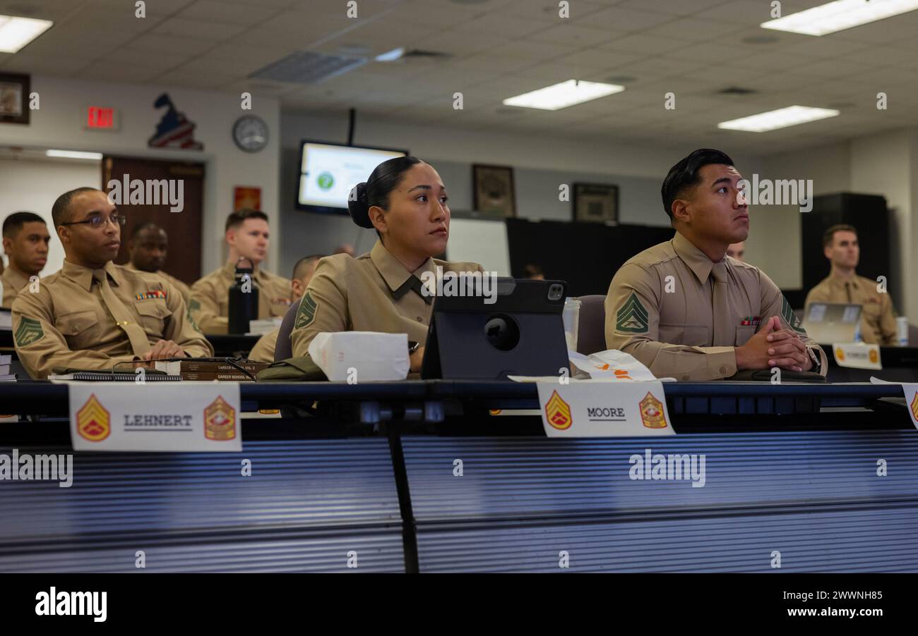 U.S. Marines watch classmates give presentations during the Career ...
