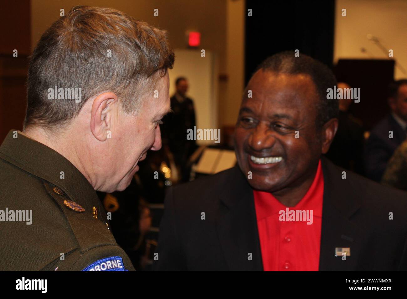 Before the pinning ceremony in Heiser Hall, Warrant Officer 1 Craig Morgan Greer meets retired Marine Corps Lt. Gen. Willie Williams. Stock Photo