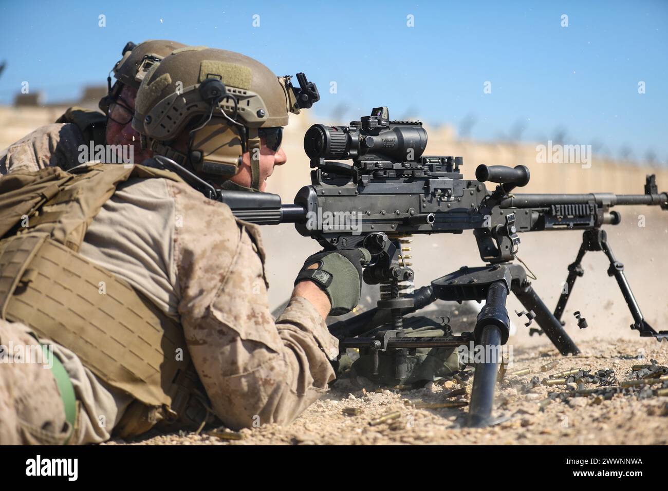 240206-M-IU565-1298 FAILAKA ISLAND, Kuwait (Feb. 6, 2024) A Marine assigned to Fleet Anti-Terrorism Security Team Central Command returns fire on opposing forces while participating in the final evolution of exercise Eager Defender 24 on Failaka Island, Kuwait, Feb. 6. Eager Defender 24 is the capstone in a series of bilateral exercises between Kuwait and U.S. naval forces, focused on enhancing mutual capabilities and interoperability in maritime security operations.  Marine Corps photo) Stock Photo