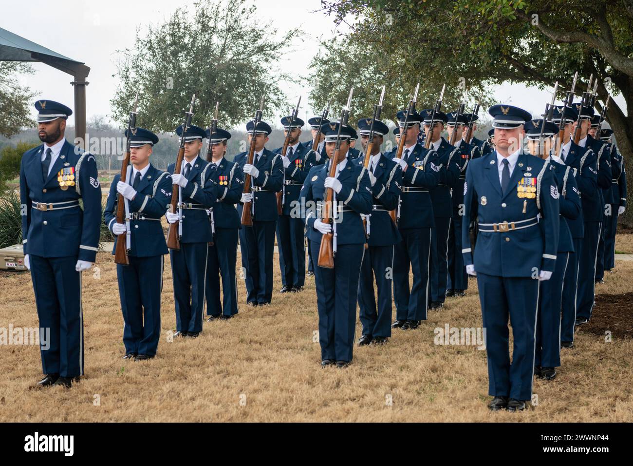 The U.S. Air Force Honor Guard stand ready during the interment of ...