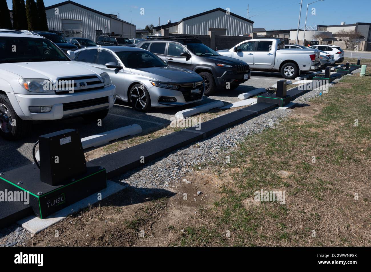 Five electric vehicle charging stations sit outside the 436th Civil