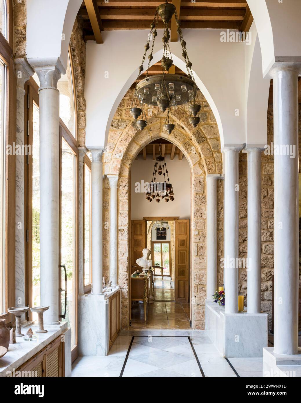 Colonnade of pillars and exposed stone doorway in luxury apartment in Beirut, Lebanon. Stock Photo