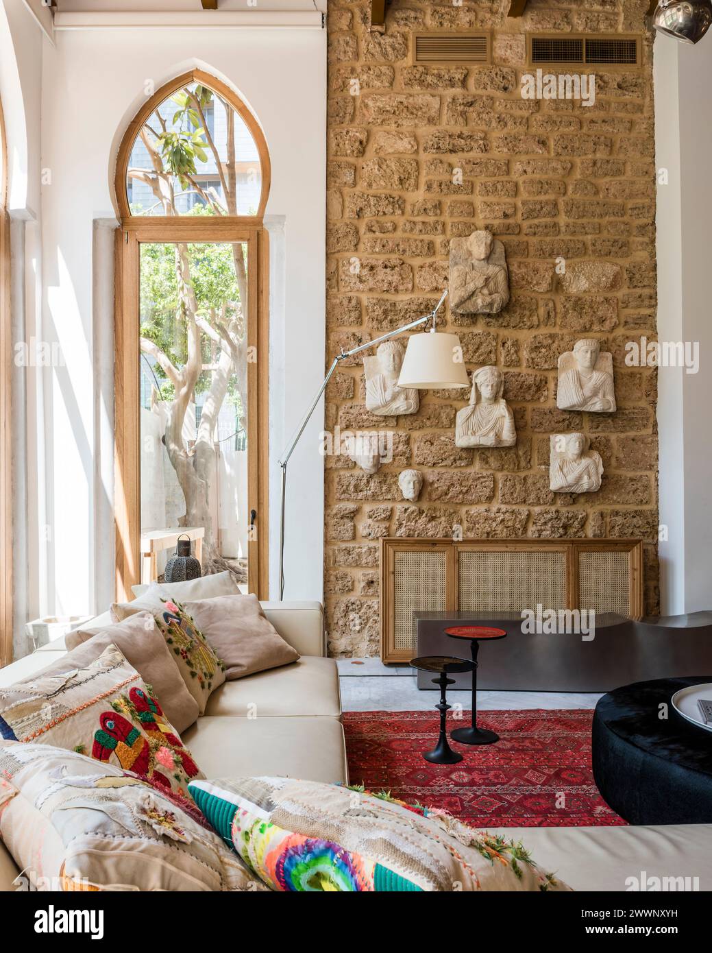 Relief carvings on exposed stone wall in luxury apartment in Beirut, Lebanon. Stock Photo