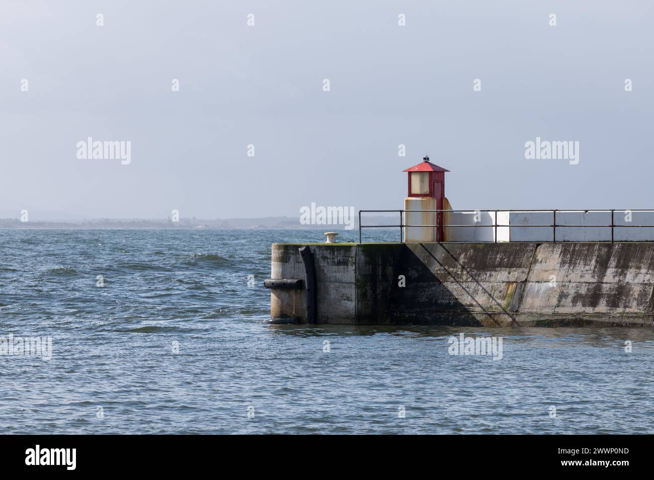 24 March 2024. Burghead,Moray,Scotland. This is the outer Pier with Navigation Lighthouses at Burghead Harbour a busy small Fishing Port. Stock Photo