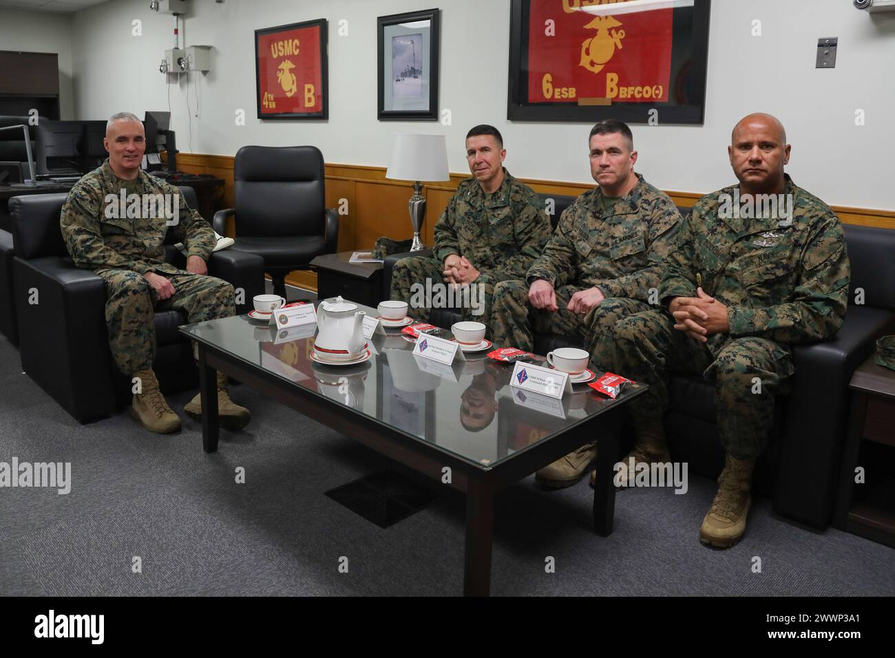 U.S. Marine Corps Maj. Gen. W. “Wes” E. Souza III (Left), Commanding General for U.S. Marine Forces Korea, hosts an office call for Maj. Gen. Benjamin T. Watson (second from left), Commanding General for 1st Marine Division, Sgt. Maj. Matthew J. Fouss (second from right), Command Sgt. Major for 1st Marine Division and Command Master Chief  Richard E. Bolton, Command Master Chief for 1 Marine Division, Feb. 29, 2024, U.S. Army Garrison Humphreys, Republic of Korea. MARFORK emphasizes the importance of constant communication between units, in order to commit to a stronger, more knowledgeable and Stock Photo