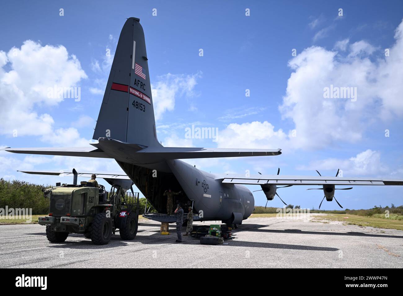 U.S. Air Force, Royal Australian Air Force and Japan Air Self-Defense Force medical personnel unload a C-130J Super Hercules during a mass casualty scenario as part of Cope North 24 at Northwest Field, Guam, Feb. 11, 2024.  U.S., RAAF and JASDF critical care air transport teams recently conducted a mass casualty exercise, treating and transporting over 50 patients from isolated airfields across Tinian, Saipan and Guam. An interchangeable medical service is a force-multiplier in the Indo-Pacific Region  Air Force Stock Photo