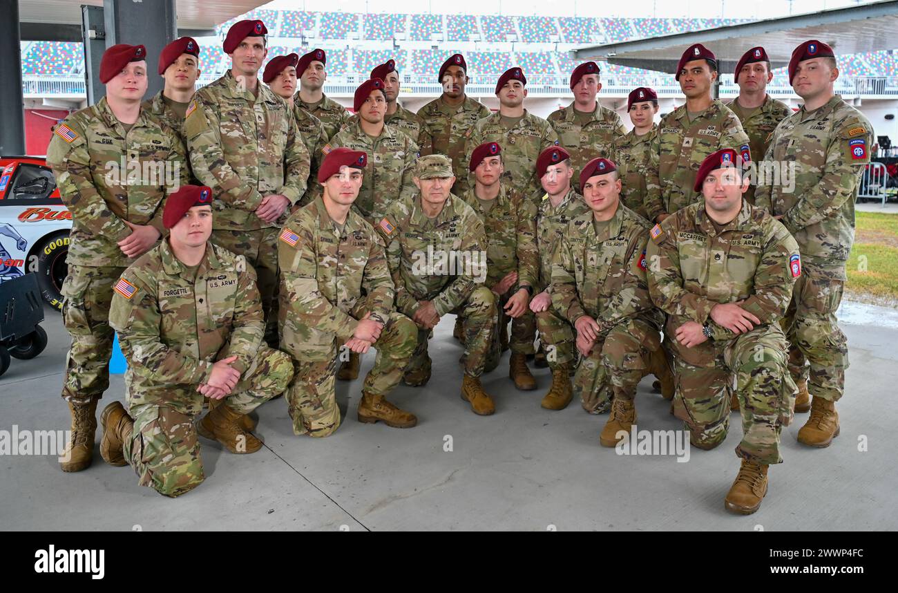 General Randy George, Chief of Staff of the Army, poses with paratroopers from the U.S. Army 82nd Airborne Division 2nd Battalion, 505th Infantry Regiment during the 2024 NASCAR Daytona 500 in Daytona Beach, Fla., Sunday, Feb. 18, 2024. The Daytona 500 is a 500-mile-long NASCAR Cup Series motor race held annually and is regarded as the most important and prestigious race on the NASCAR calendar. Stock Photo