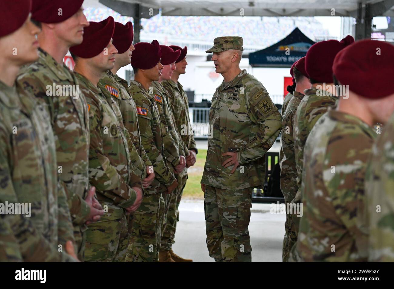 General Randy George, Chief of Staff of the Army, greets paratroopers from the U.S. Army 82nd Airborne Division 2nd Battalion, 505th Infantry Regiment during the 2024 NASCAR Daytona 500 in Daytona Beach, Fla., Sunday, Feb. 18, 2024. The Daytona 500 is a 500-mile-long NASCAR Cup Series motor race held annually and is regarded as the most important and prestigious race on the NASCAR calendar. Stock Photo