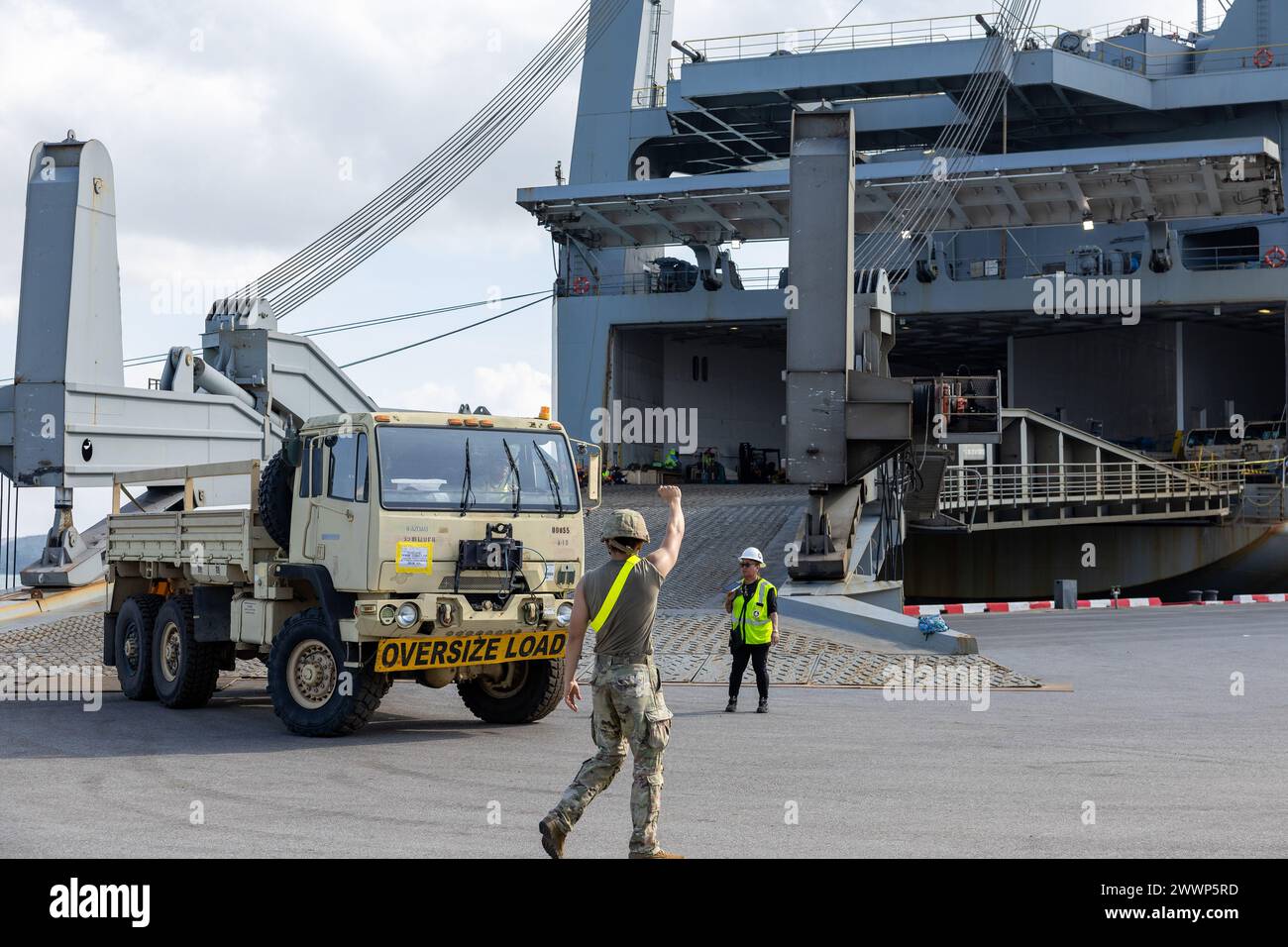 A vehicle is driven out of Military Sealift Command (MSC) chartered ship MV Cape Horn (T-AKR 5068) during an offload for exercise Cobra Gold 2024 at Sattahip, Thailand, Feb. 19. CG24 is the 43rd iteration of the Joint Cobra Gold series of exercises. CG24 emphasizes coordination on readiness, civic action, humanitarian assistance and disaster relief, and seeks to expand regional cooperation and collaboration in these vital areas. MSC directs and supports operations for approximately 140 civilian-crewed ships that replenish U.S. Navy ships at sea, conduct specialized missions, preposition combat Stock Photo