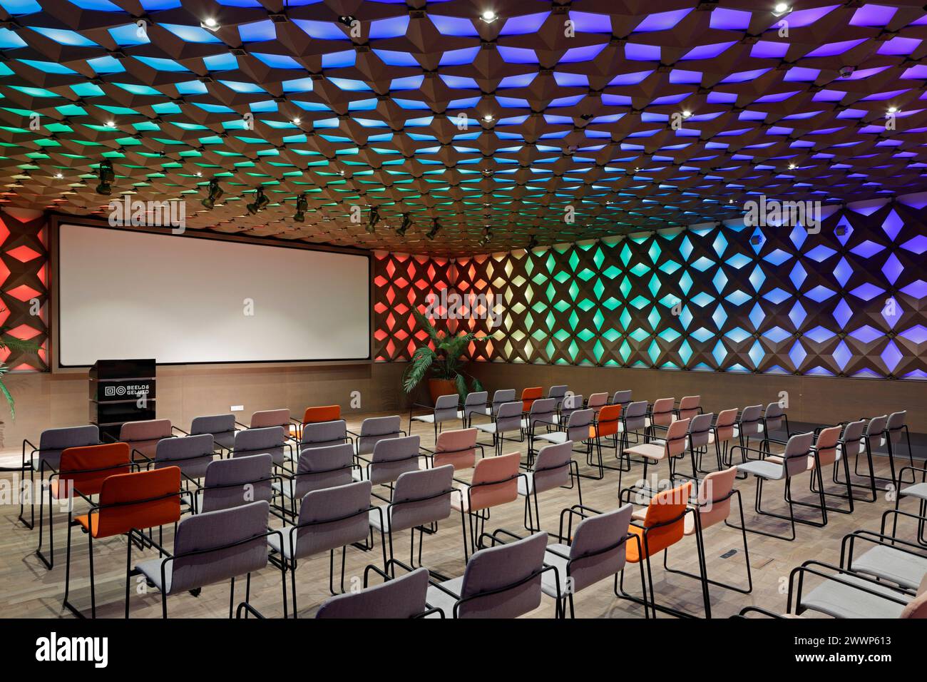 Meeting room, with multicoloured ceiling and wall lighting. Dutch Institute For Sound & Vision, Hilversum, Netherlands. Architect: Neutelings Riedijk Stock Photo