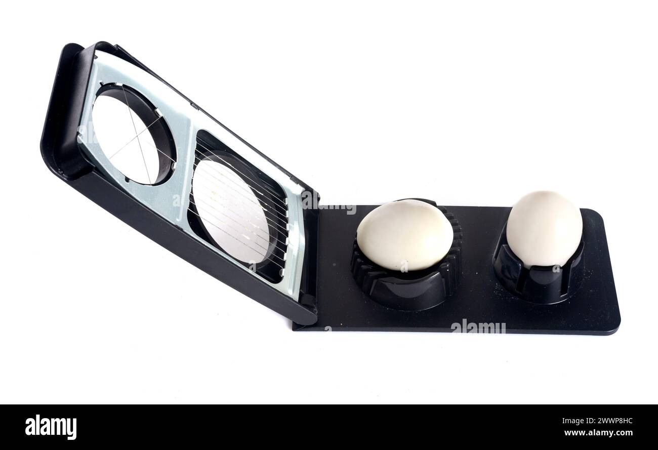 Egg slicer in front of white background Stock Photo