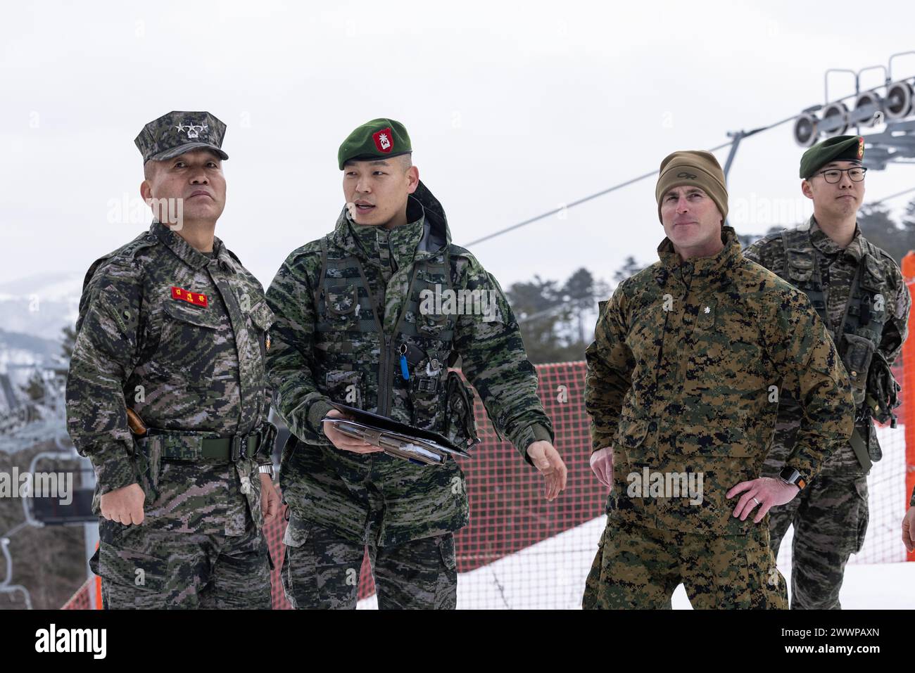 Republic of Korea Marine Corps Commandant Lt. Gen. Kim Gye-hwan, far left, and U.S. Marine Corps Lt. Col. Christopher Macak, second to right, discuss the bilateral training taking place during Korea Viper 24.1 at Pyeongchang, Republic of Korea, Feb. 14, 2024. In its first iteration, Korea Viper demonstrates the ROK-US Marine Corps ability to respond decisively in the region as a singular, unified force while strengthening relationships and trust between the two allies. The Marines are with 2d Battalion, 7th Marines. 2/7 is forward deployed in the Indo-Pacific under 4th Marine Regiment, 3d Mari Stock Photo