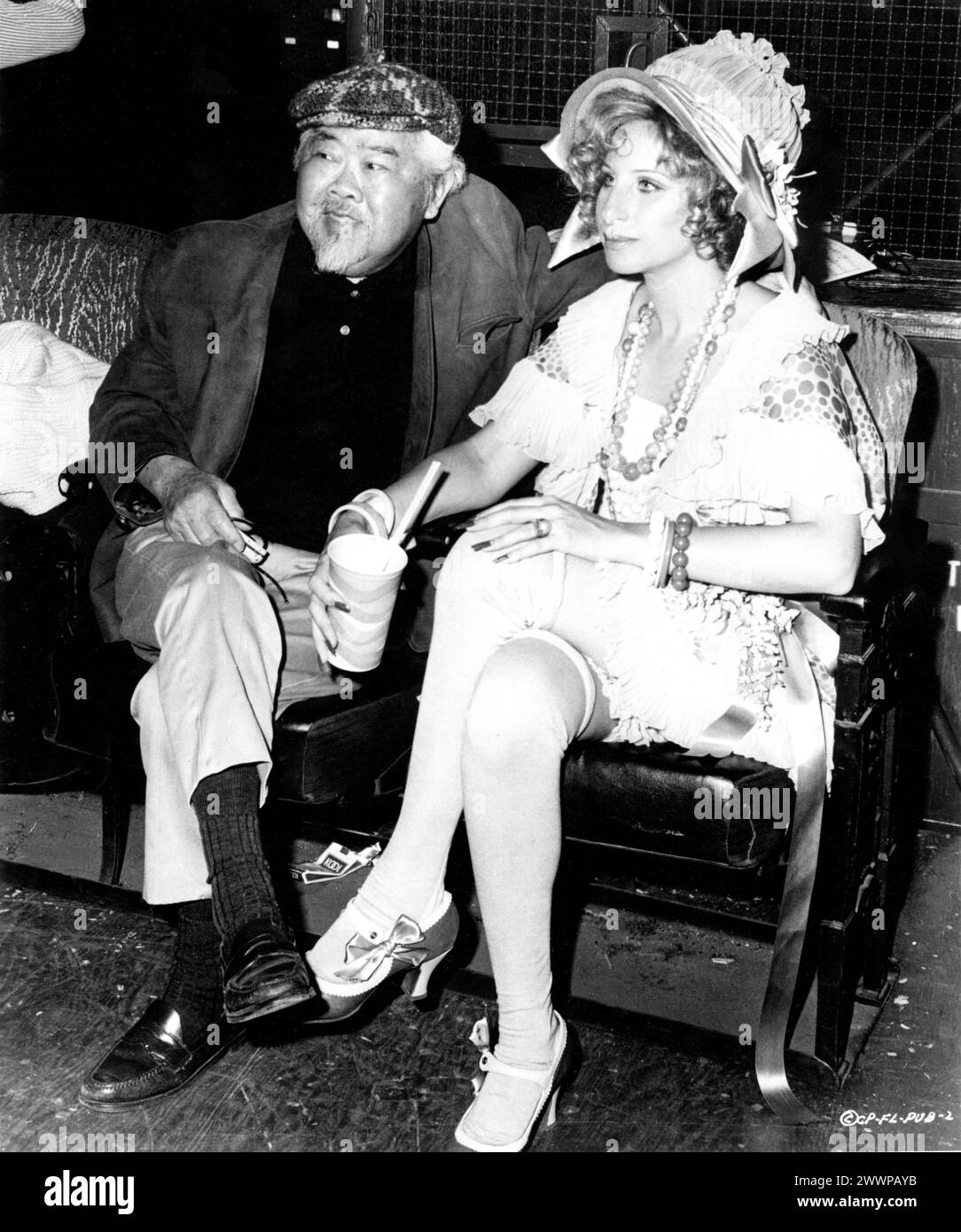 Cinematographer JAMES WONG HOWE and BARBRA STREISAND on set candid