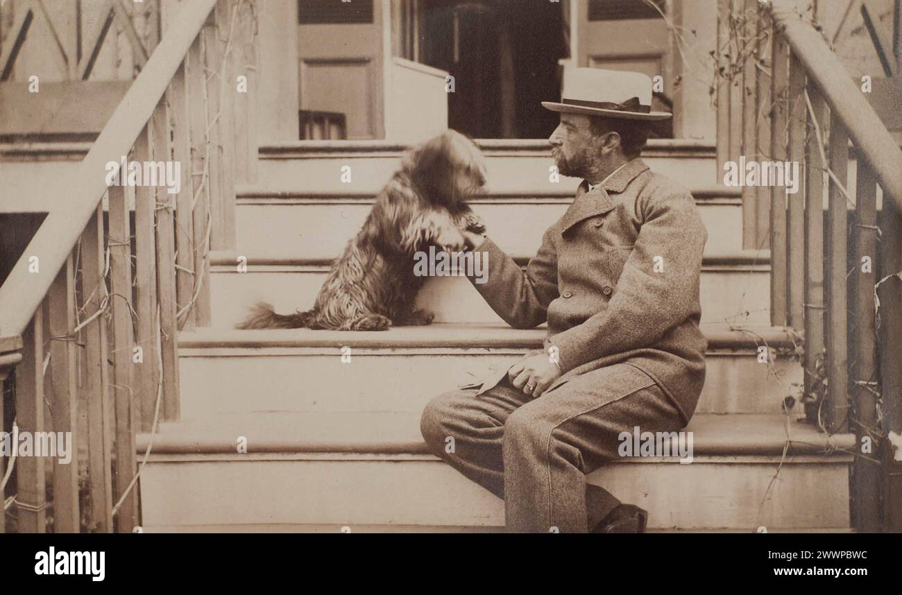 Henry Adams seated with dog on steps of piazza, c. 1883 Stock Photo