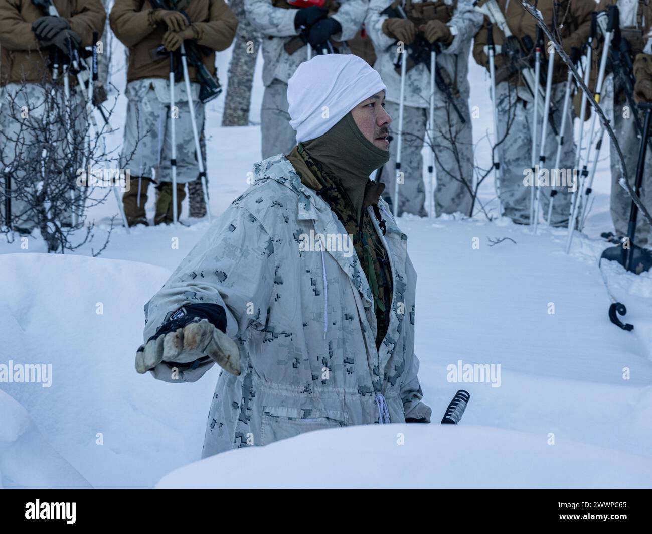 U.S. Marine Corps Gunnery Sgt. Joseph Quinlivan, a NATO Winter Instructor Course instructor with 1st Battalion, 2nd Marine Regiment, 2nd Marine Division, teaching Marines and Sailors how to construct a defensive posture during Cold Weather Training in preparation for the NATO exercise Nordic Response 24 in Setermoen, Norway, Feb. 5, 2024. Nordic Response is a Norwegian national readiness and defense exercise designed to enhance military capabilities and allied cooperation in high-intensity warfighting in a challenging arctic environment. This exercise will test military activities ranging from Stock Photo