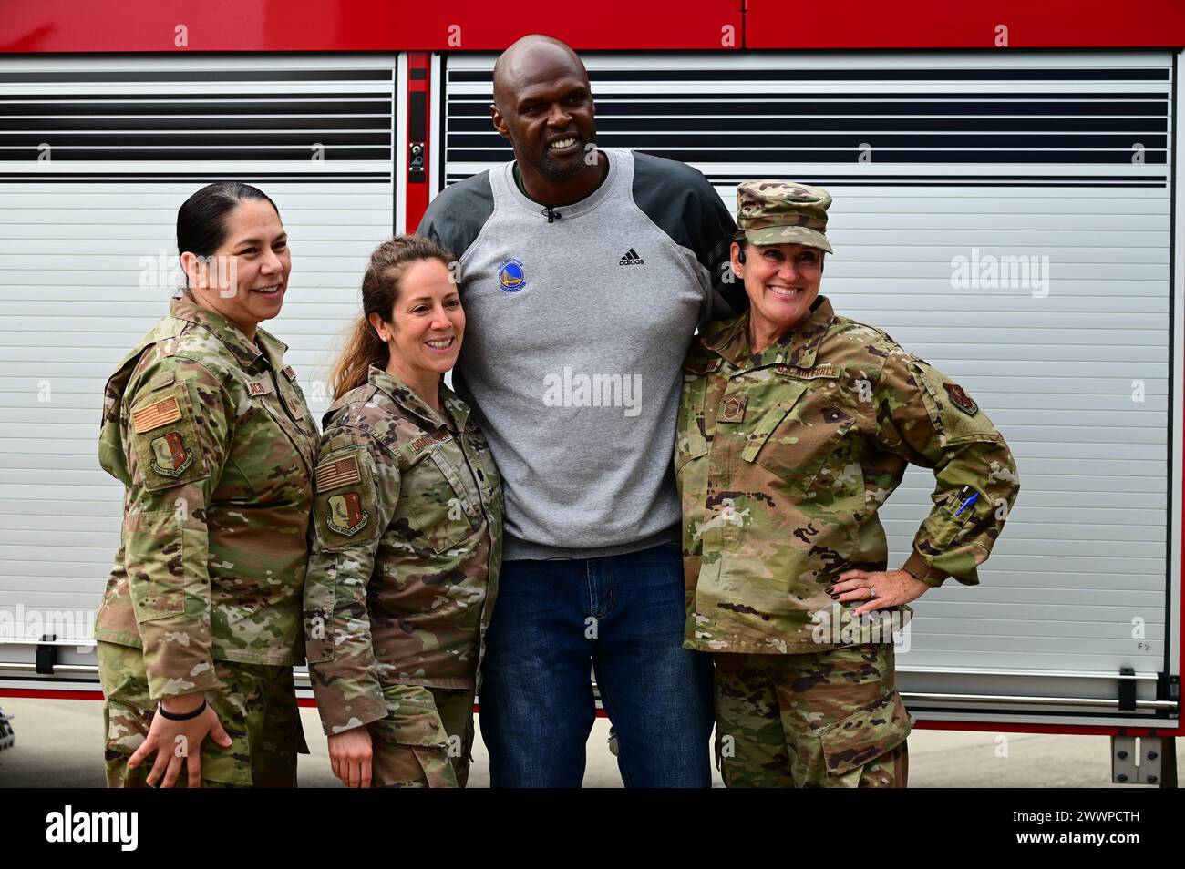 Former NBA basketball player Adonal Foyle takes a photo with U.S. Air