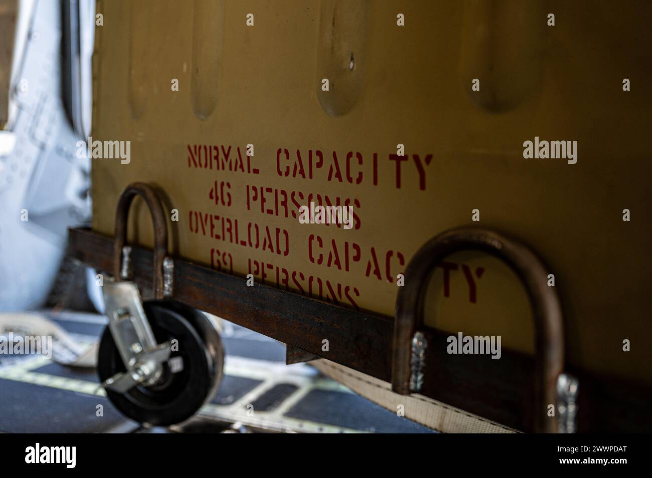 A 46-man life raft rigid container sits onboard a C-17 Globemaster III ...