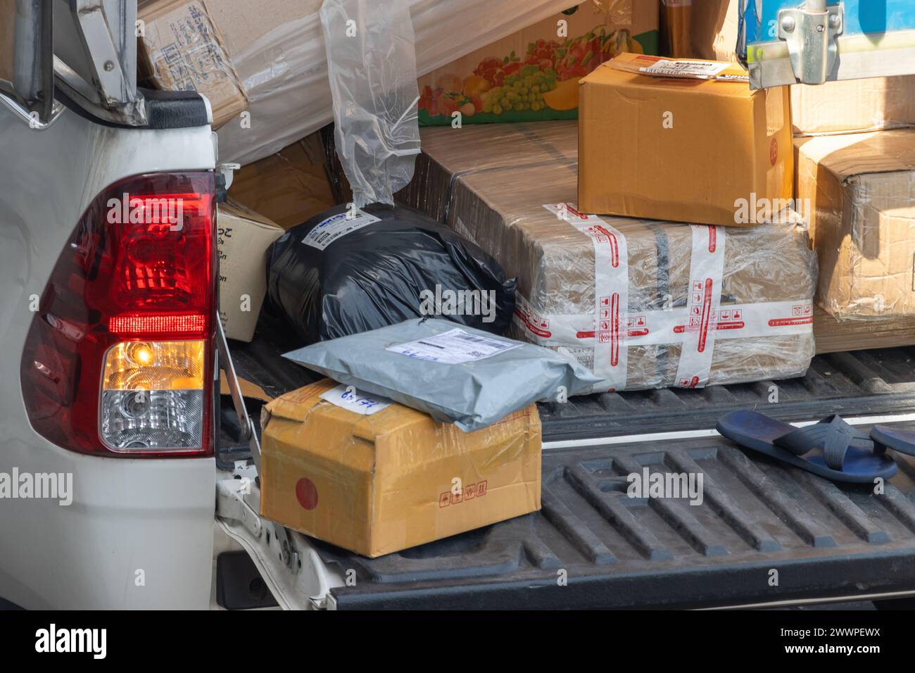 Packages on the pick-up car of parcel service is ready for delivery Stock Photo