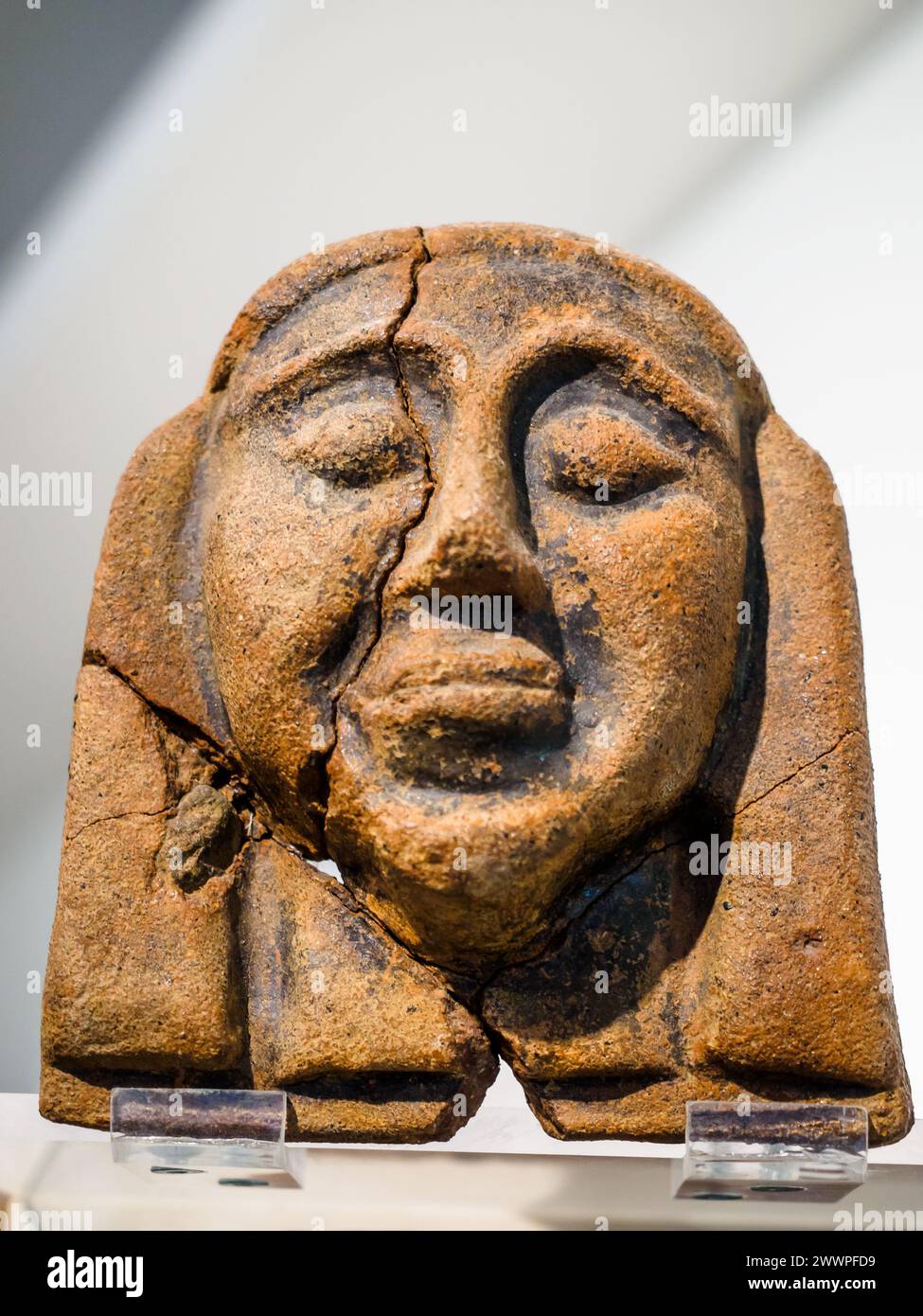 Antefixes (cup terminals) with female head. Molded terracotta. 590580