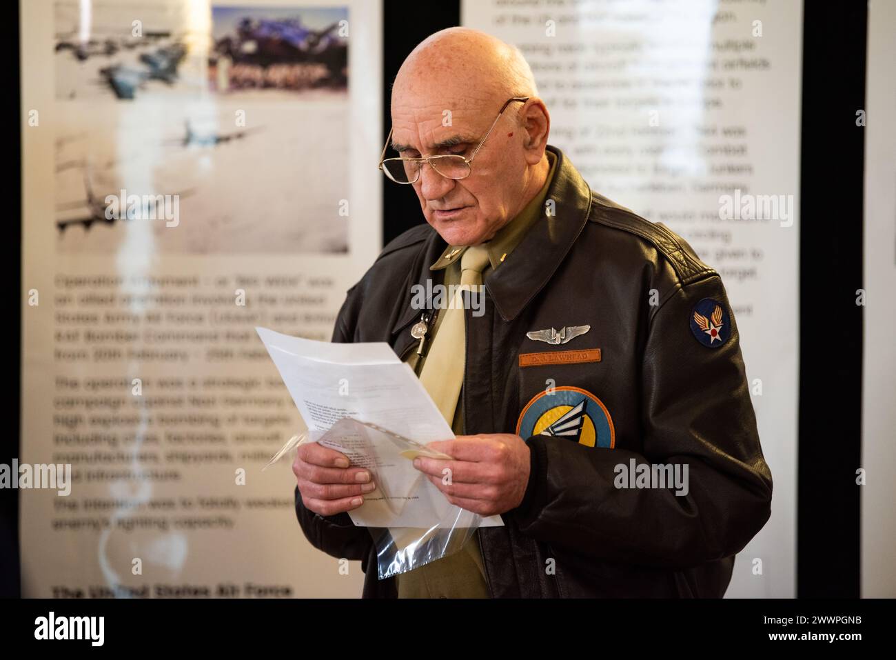 Brian Francis reads a poem during a Ceremony of Remembrance at Stanwick Lakes, England, Feb. 22, 2024. U.S. and U.K. leaders gathered to honor 17 Airmen who died in a midair collision on Feb. 22, 1944, involving B-17 Flying Fortresses from the 303rd Bombardment Group at RAF Molesworth and the 384th Bombardment Group at RAF Grafton Underwood. The Airmen were part of Operation Argument, or 'The Big Week,' targeting enemy industrial sites and aircraft facilities in Central Europe to secure Allied air superiority for the upcoming landings in France in June 1944.  Air Force Stock Photo