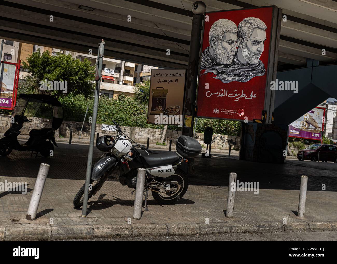Beirut, Lebanon. 20th Mar, 2024. A portrait of slain Iranian General and Quds Force Commander Qasem Soleimani and Iraqi Popular Mobilization Forces (PMF) commander Abu Mahdi al-Muhandis in the Dahieh suburb of Beirut, Lebanon, on Mar. 20, 2024. Soleimani and Muhandis were assassinated by a US drone strike on Jan. 3, 2020. Dahieh is a Hezbollah-controlled neighborhood in Beirut. (Photo by Collin Mayfield/Sipa USA) Credit: Sipa USA/Alamy Live News Stock Photo