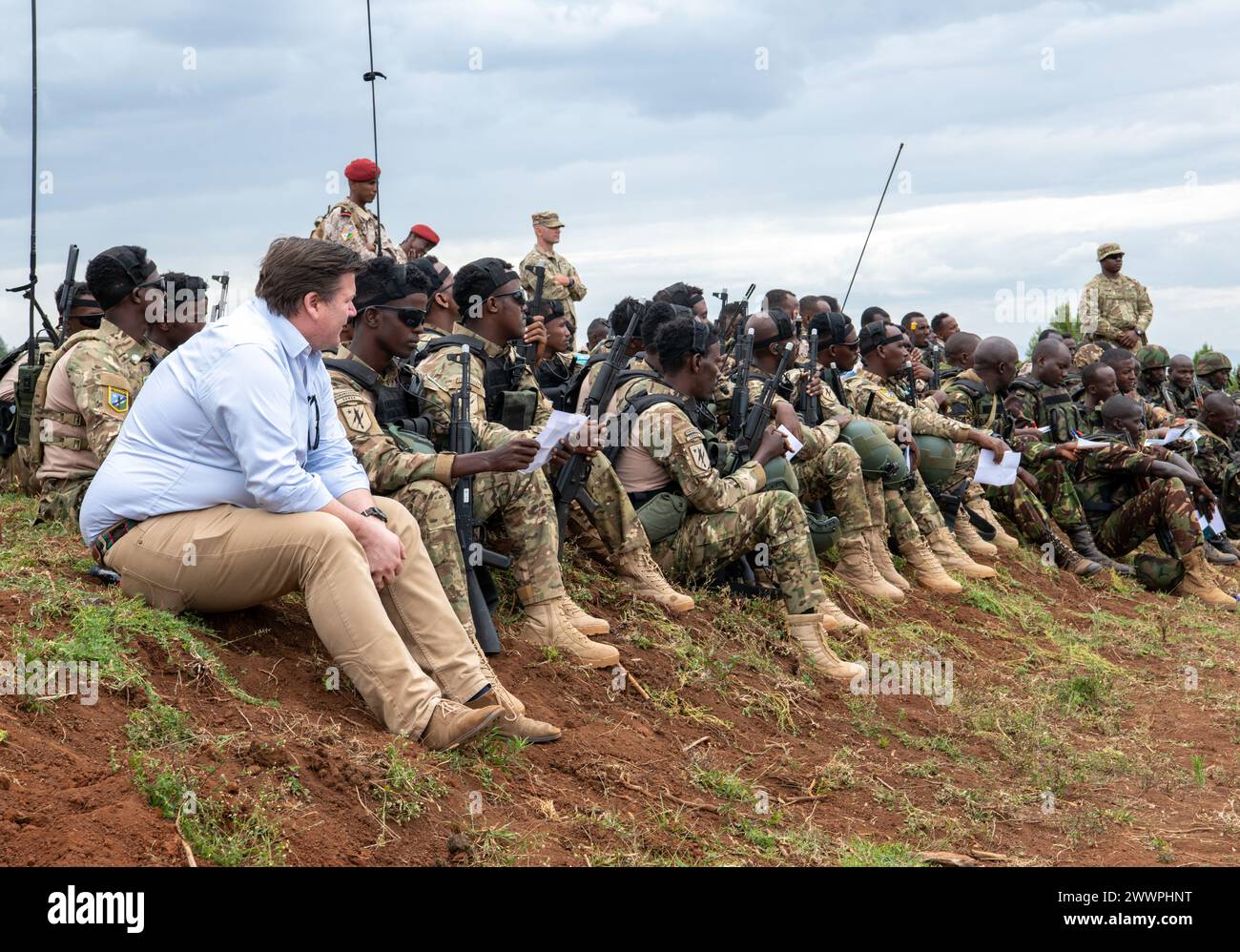 James Heappey, Minister of State for the Armed Forces of the United Kingdom, observes Justified Accord 2024 (JA24) participants conducting urban combat operations training at the Counter Insurgency Terrorism and Stability Operations (CITSO) Training Centre, Nanyuki, Kenya, Feb. 26, 2024. The British army's 11th Security Force Assistance Brigade is leading urban operations, counter improvised explosive device and small unmanned aircraft systems training during the multinational field training held at CITSO for JA24. JA24 is U.S. Africa Command's largest exercise in East Africa, running from Feb Stock Photo