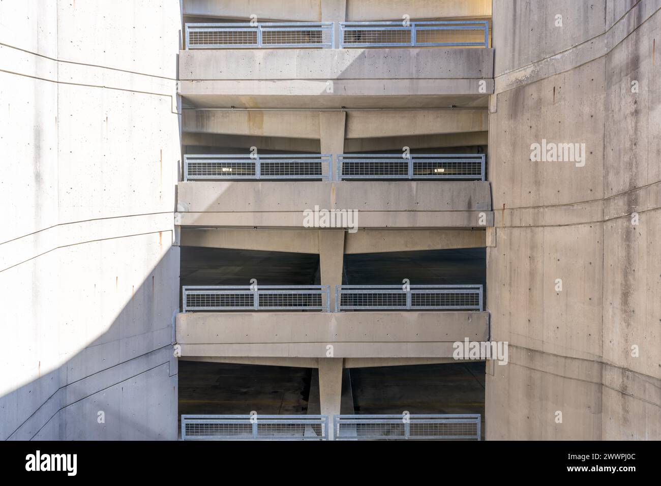 Elevation view of a multi level concrete parking garage, car park, during the day. Stock Photo