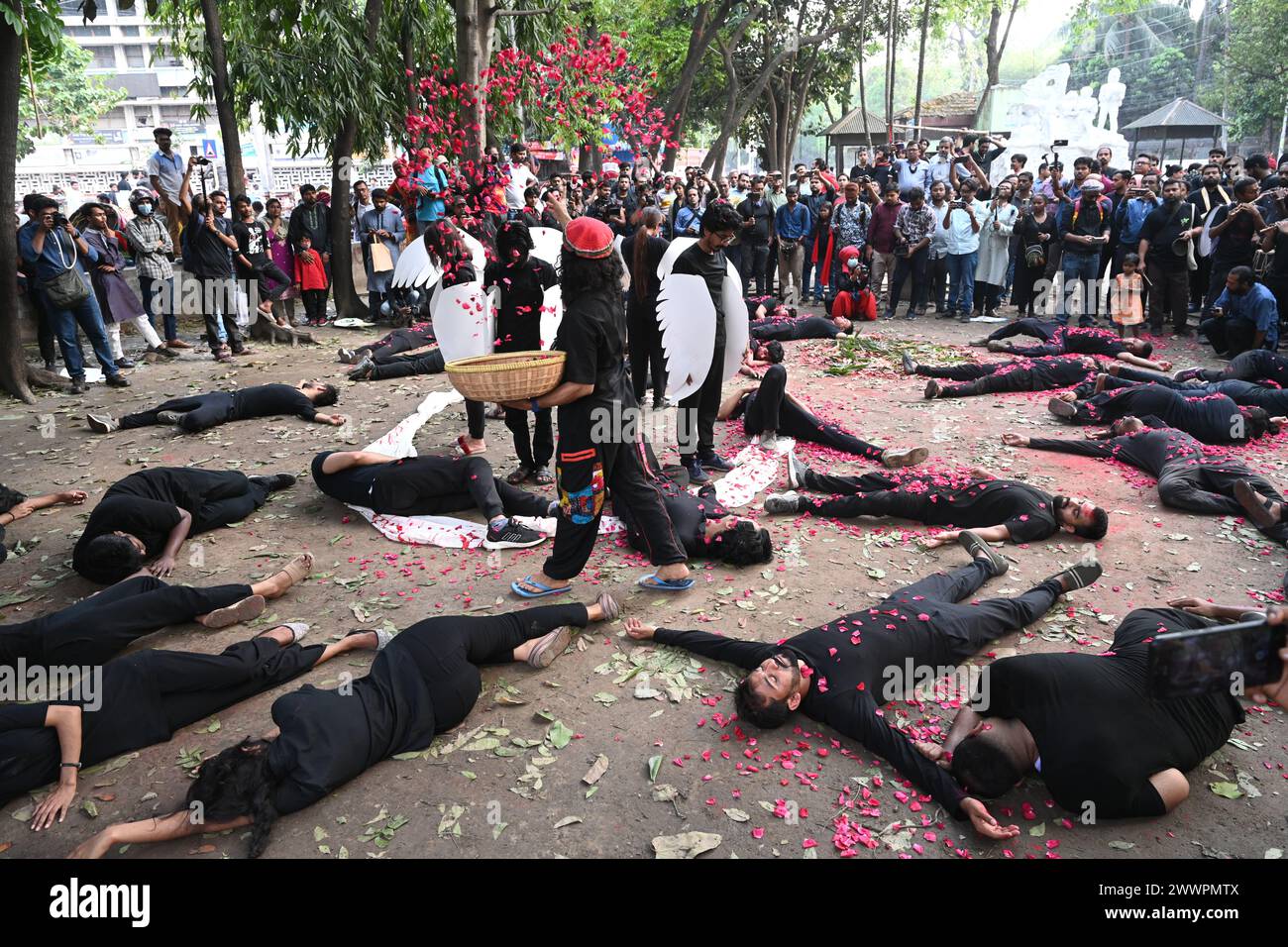 Dhaka, Bangladesh. 25th Mar, 2024. Members of the Prachyanat School of Acting and Design join the annual Lal Jatra procession and street performance to pay tribute to martyrs of the 1971 Bangladesh genocide, in Dhaka, Bangladesh, on March 25, 2023. The National Genocide Day is observed annually to remember the victims of the Operation Searchlight military crackdown carried out by Pakistan's Army on 25 March 1971 in Bangladesh. Credit: Mamunur Rashid/Alamy Live News Stock Photo