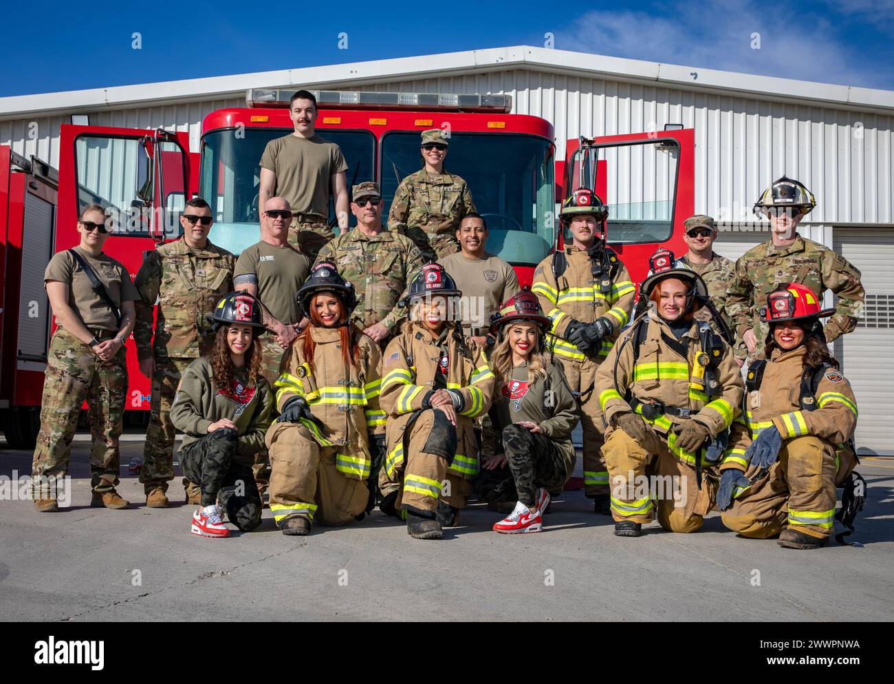 Tampa Bay Buccaneers Cheerleaders Take A Group Picture With The 467th tampa-bay-buccaneers-cheerleaders-take-a-group-picture-with-the-467th