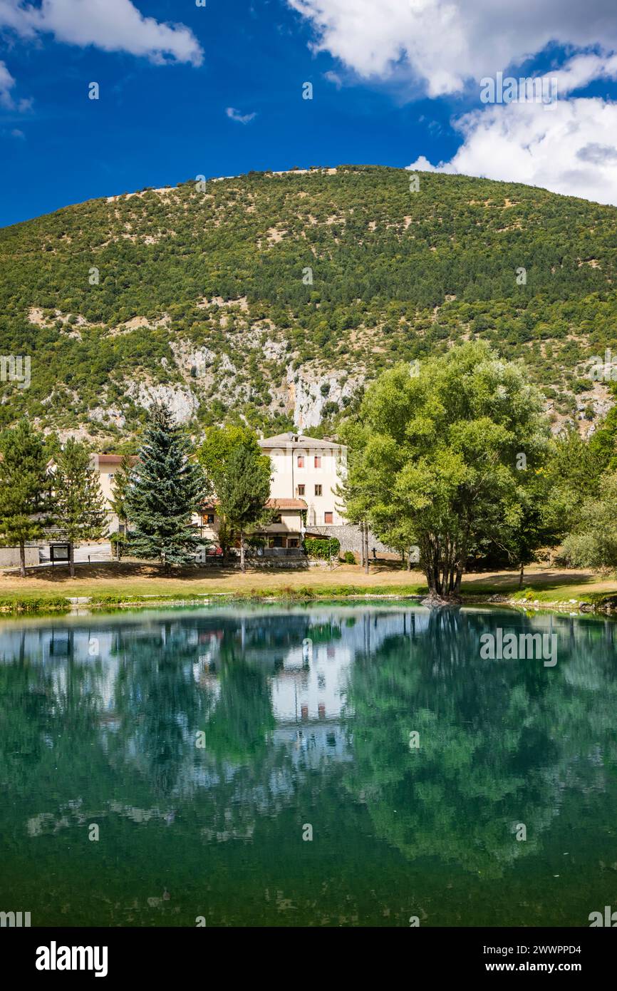 The beautiful village of Villalago, in the province of L'Aquila in Abruzzo, central Italy. The small lake near the town centre, immersed in the nature Stock Photo