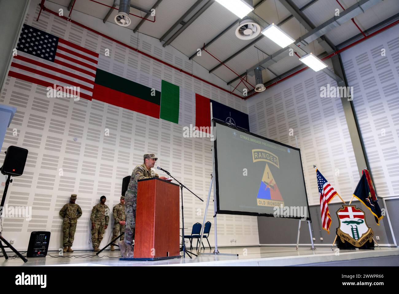 Lt. Col. Trinidad Chavez, Battalion Commander of 1st Battalion, 6th Infantry Regiment, 2nd Brigade Combat Team, 1st Armored Division out of Fort Bliss, Texas, speaks during a Pre-Ranger Course graduation ceremony at Novo Selo Training Area (NSTA), Bulgaria, Feb. 17, 2024. Over eight days, the Pre-Ranger course evaluated the Strike Brigade Soldiers' skills that are needed to succeed at Ranger School and to enhance lethality on the battlefield.  Army Stock Photo
