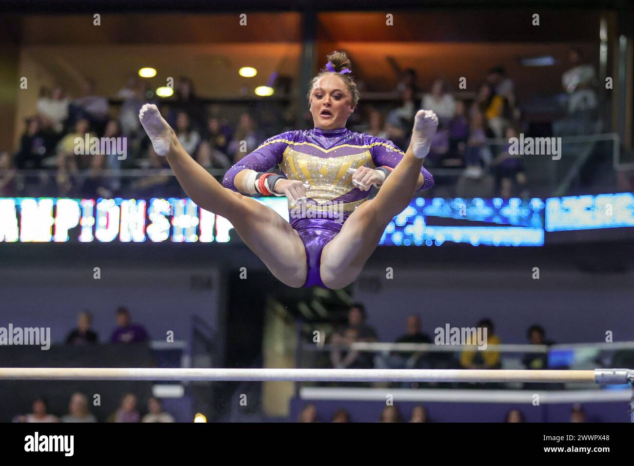 New Orleans, LA, USA. 23rd Mar, 2024. LSU's Savannah Schoenherr competes on the uneven bars during NCAA Gymnastics action in the SEC Championships at the Smoothie King Center in New Orleans, LA. Jonathan Mailhes/CSM/Alamy Live News Stock Photo