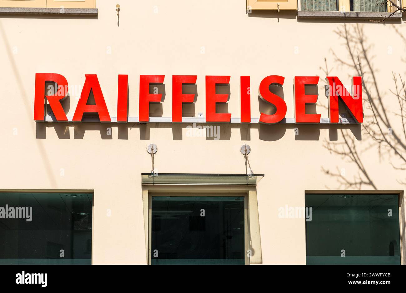 Vira Gambarogno, Ticino, Switzerland - March 21, 2024: Raiffeisen sign of the Swiss multinational investment bank in Viara Gambarogno, district of Loc Stock Photo