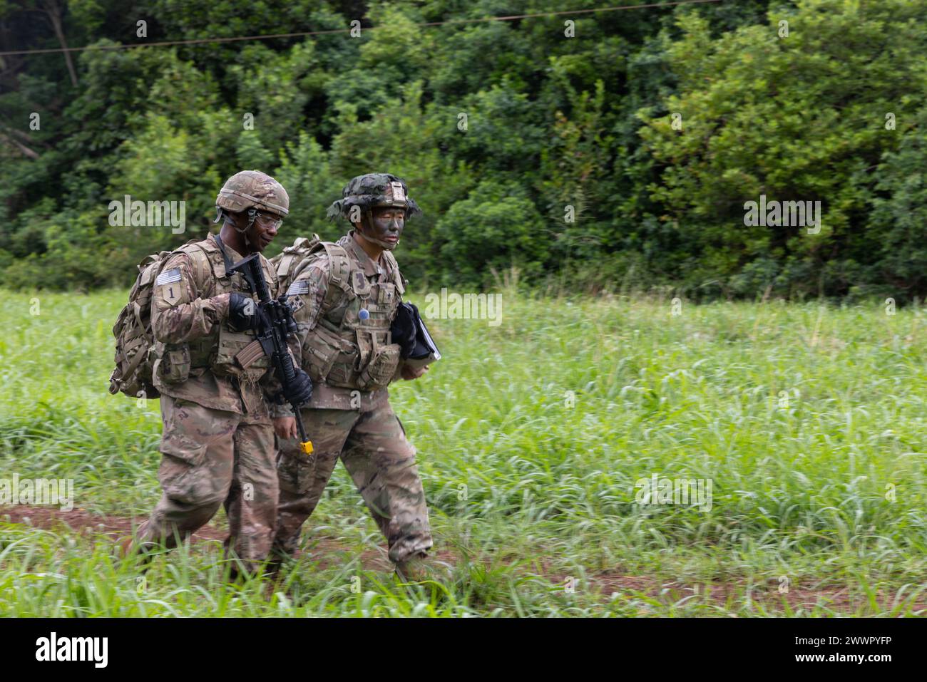 U.S. Army Sgt. Brandon Jordan (left), a religious affairs ...