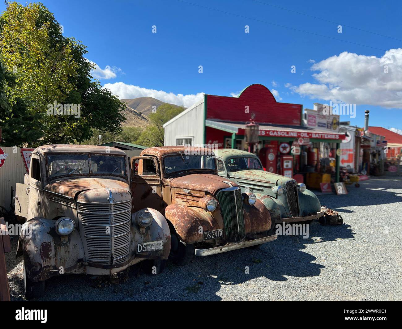 A row of vintage cars ina metal scrap yard Stock Photo