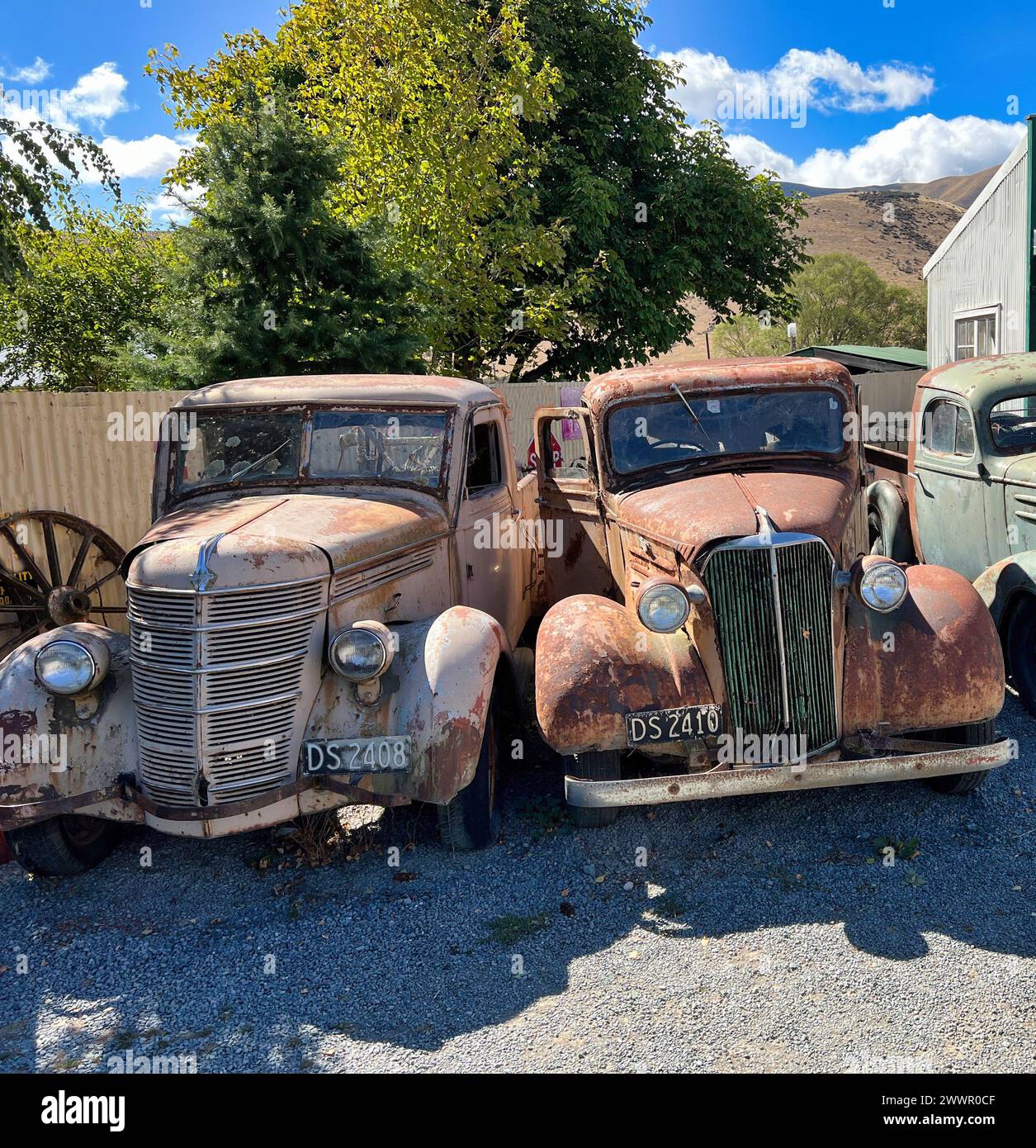 Two vintage trucks in a metal scrap yard Stock Photo