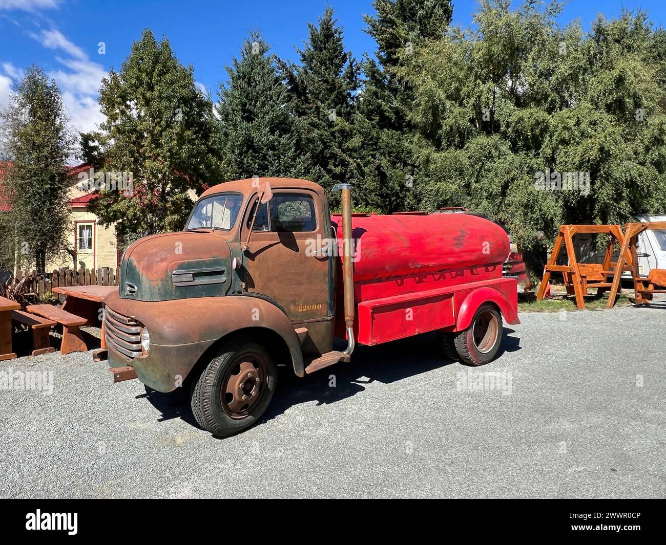 Vintage petrol tanker standing in a junk yard Stock Photo