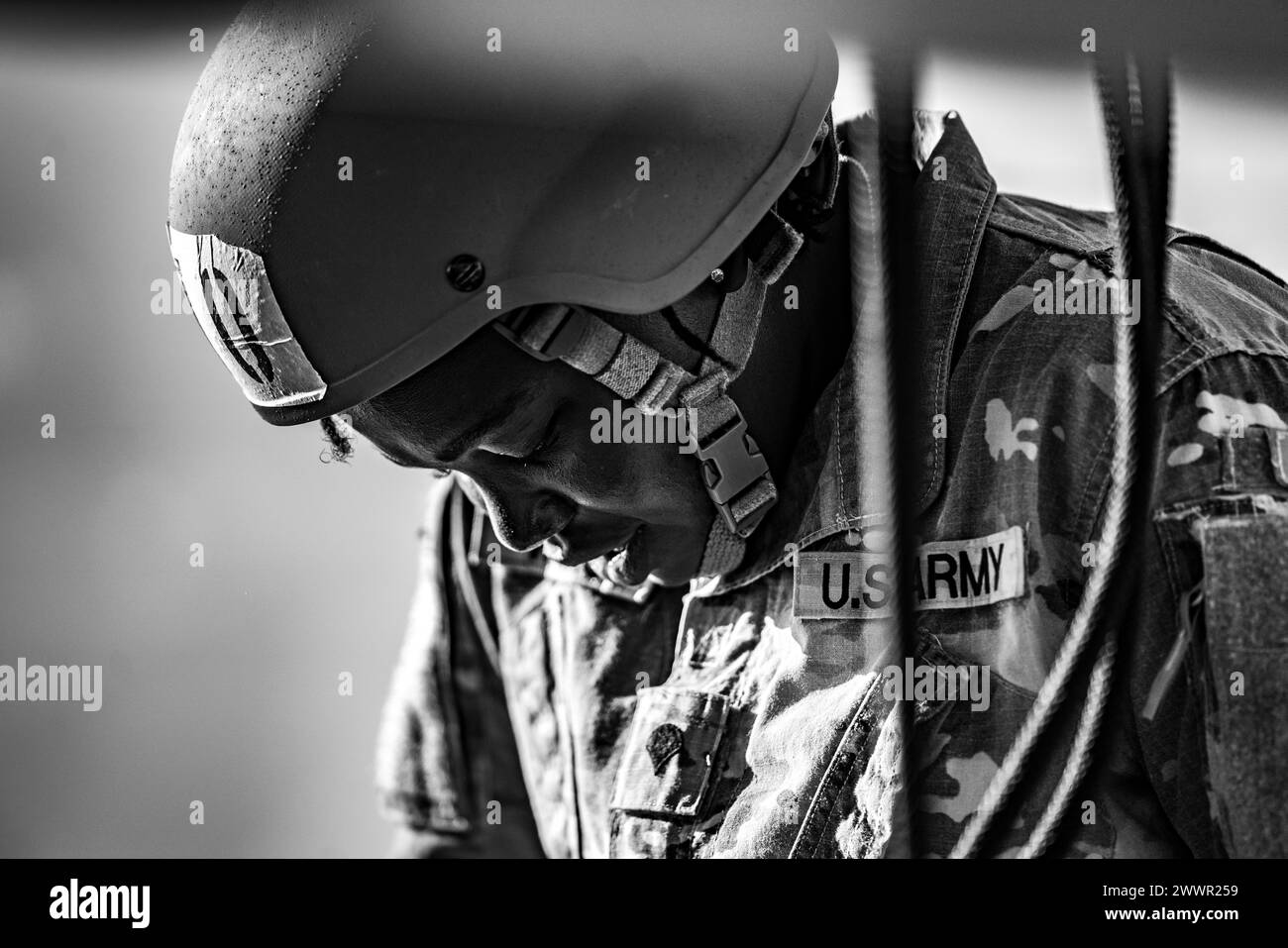 Air Assault candidates rappel off the rappel towers on Camp Buehring, Kuwait, February 20, 2024. After successfully rappeling from the towers, candidates will rappel out of rotary wing aircraft.  Army Stock Photo