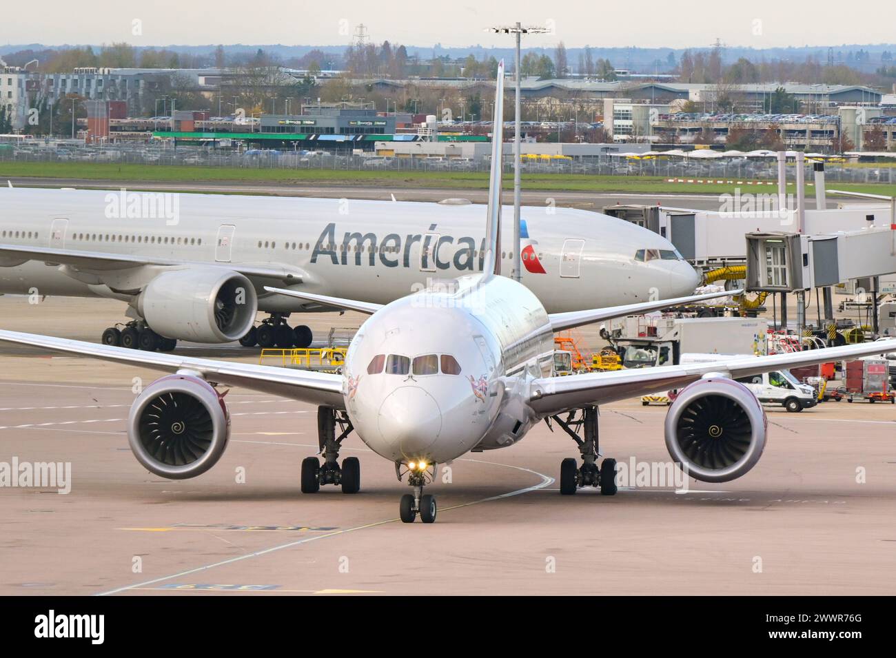 London, England, UK - 30 November 2023: Virgin Atlantic Boeing 787 jet taxiing in front of an American Airlines jet at London Heathrow airport. Stock Photo