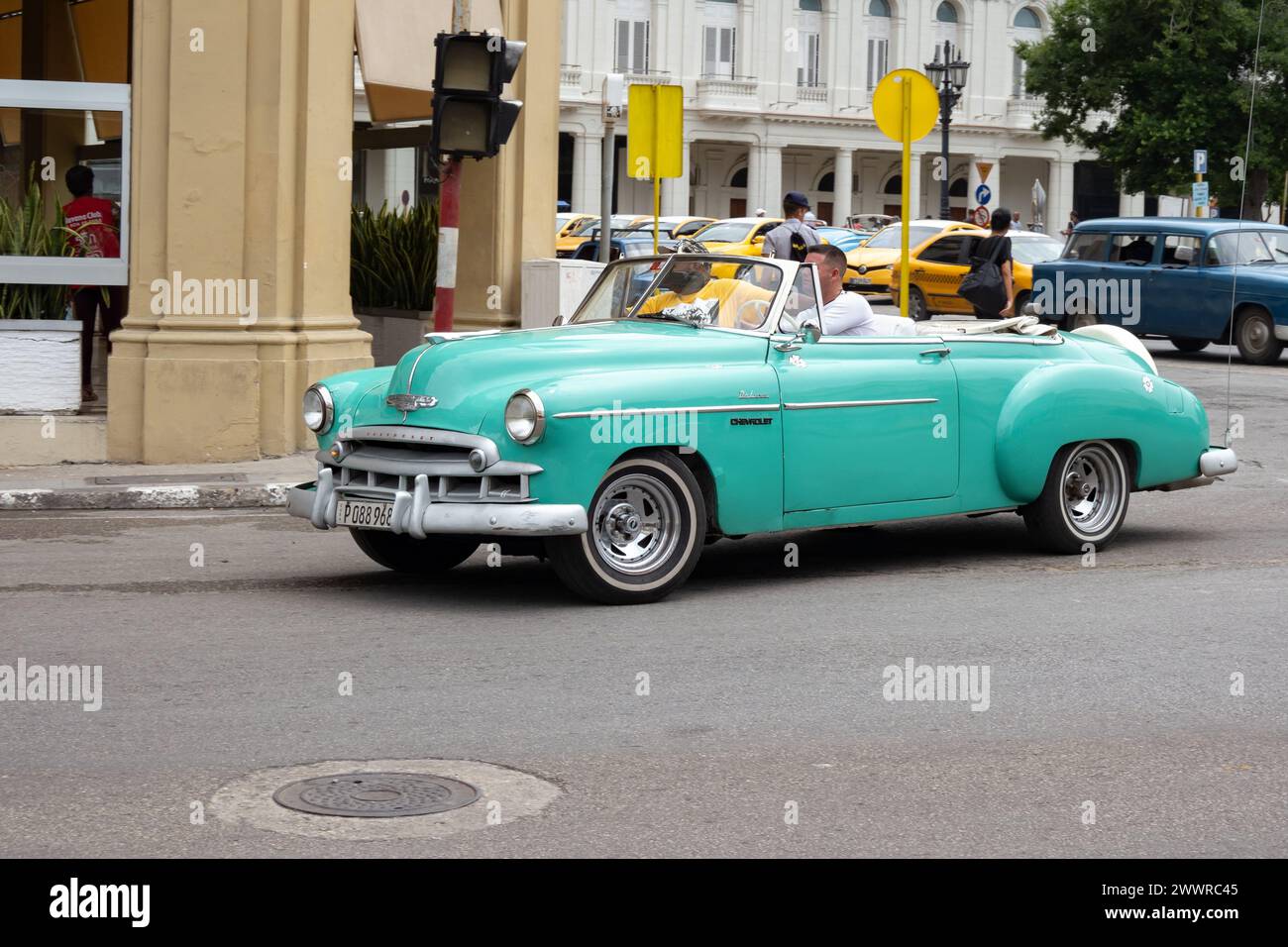 HAVANA, CUBA - AUGUST 28, 2023: Chevrolet Deluxe 1950 Convertible in azure blue and green colour in streets of Havana, Cuba Stock Photo
