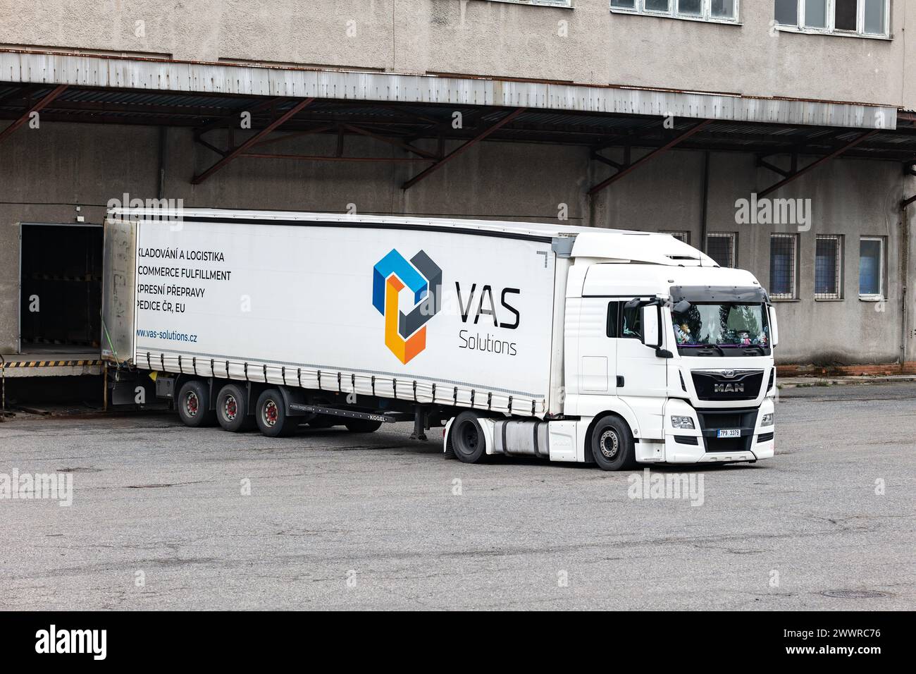 SENOV, CZECH REPUBLIC - MARCH 1, 2024: MAN TGA truck of VAS Solution transportation logistics company unloading cargo Stock Photo